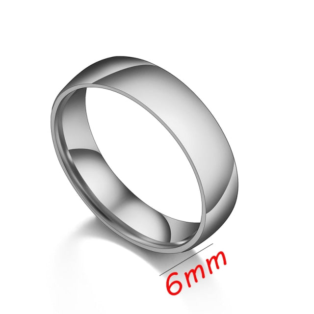 Stainless steel gold ring for men with black diamond and white diamond halo, engraved band.
