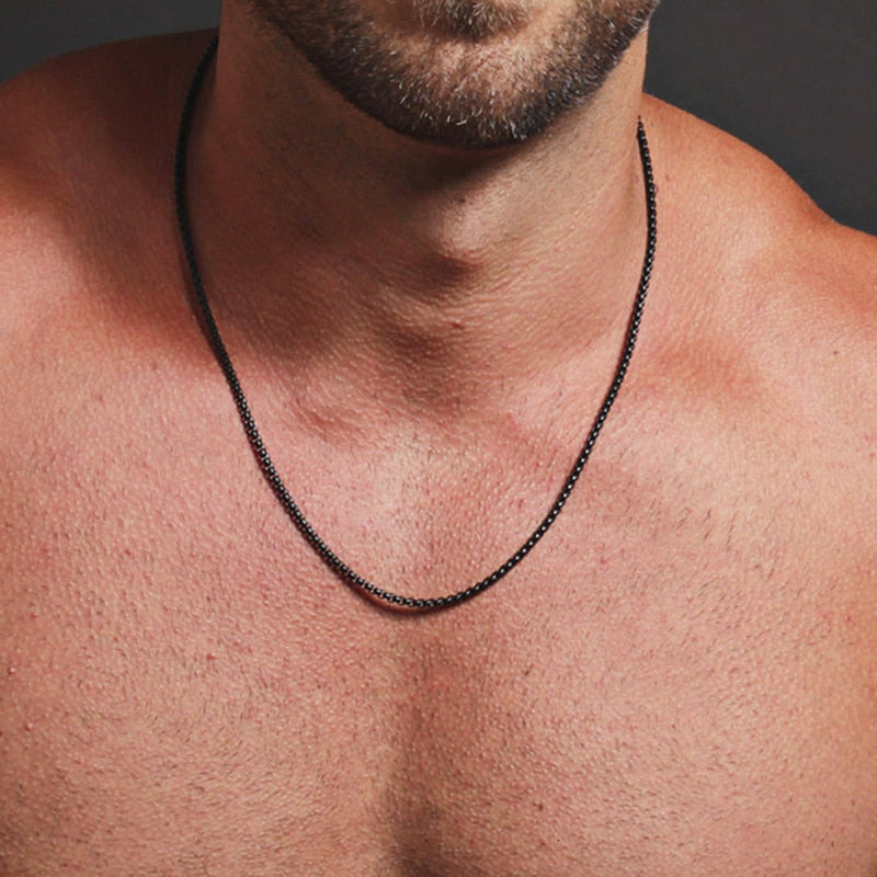 Antonios Cuban Necklace in black stainless steel, worn by a model.