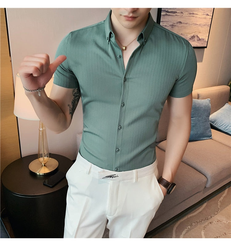 Homme short sleeve shirt in olive green, striped pattern, worn by a man in a casual setting.