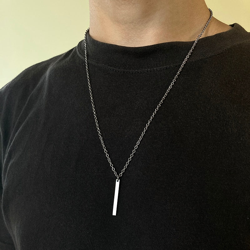 Minimalist stainless steel necklace for men with pendant, shown in polished silver finish.