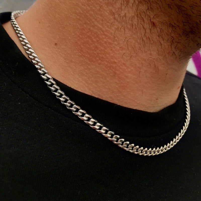 Antonios Cuban Stainless Steel Necklace on a man's neck, showcasing its polished finish and sleek design.