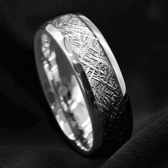 Elegant men's stainless steel ring with textured design and polished finish.