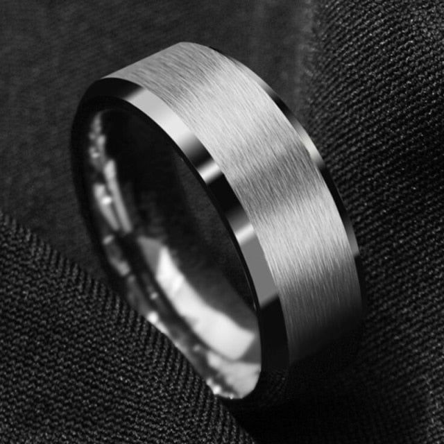 Antonios Classy Stainless Steel Ring for men with polished band on black fabric.