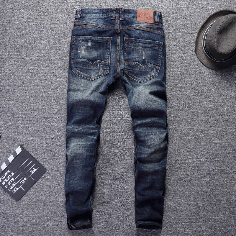 Antonios Italian Slim Jeans in vintage denim style on a flat surface with accessories.