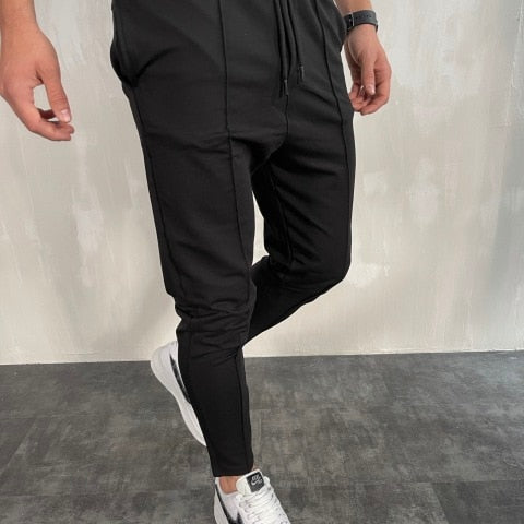 Antonios Streetwear Joggers Men in black, relaxed fit, comfortable polyester and cotton blend.