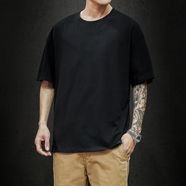 Men's black pure cotton t-shirt with stylized hem and round sleeves from Antonios, ideal for smart casual wear.