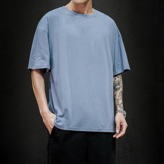 Men's light blue pure cotton T-shirt by Antonios with stylized hem and rounded sleeves, ideal for smart casual style.