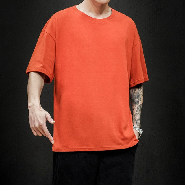 Men's orange t-shirt made from pure cotton, featuring a soft and breathable material, perfect for smart casual summer outfits.