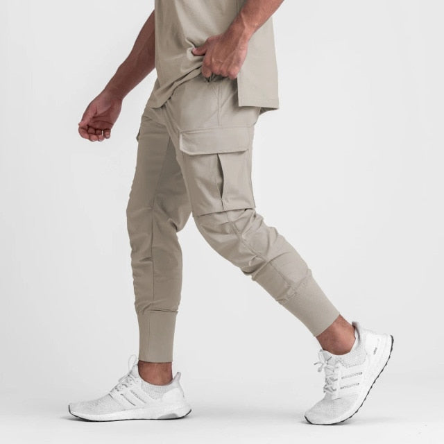 Men wearing khaki Antonios Sport Street Joggers with white sneakers.
