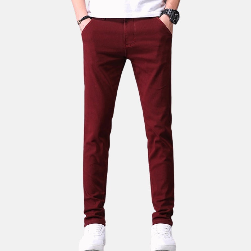 Antonios Slim Fit cotton stretch trousers for men in burgundy, styled with casual white sneakers.