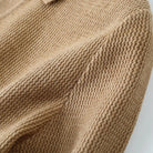 Close-up of a brown knitted fabric texture