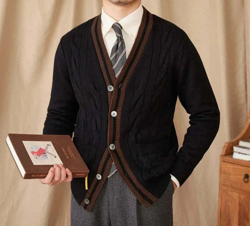 Antonios twisted knit cardigan in Italian vintage style, black with brown trim, worn by a man holding a book.