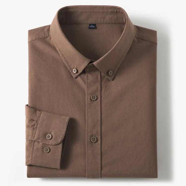 A folded brown long-sleeve button-down shirt with a classic collar and a single cuff, displayed on a clean white background.