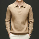 Beige sweater worn by a mannequin against a dark background