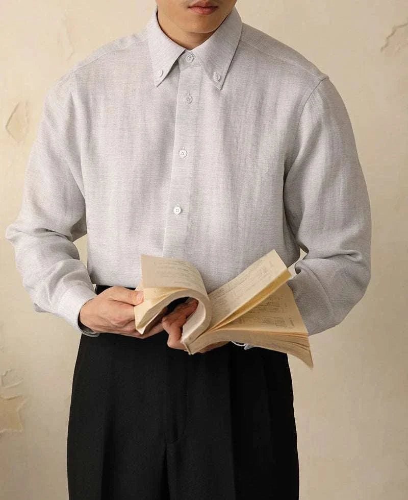 Antonios one-piece collar cotton shirt in high-quality cotton and viscose, worn by a man holding a book.