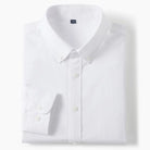 A folded white long-sleeve button-down dress shirt with a pointed collar and a single-button cuff, shown on a clean white background.