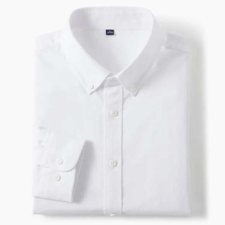 A folded white long-sleeve button-down dress shirt with a pointed collar and a single-button cuff, shown on a clean white background.