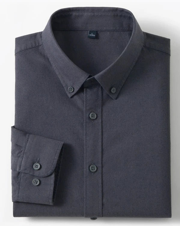 A folded dark gray long-sleeve button-down shirt with a pointed collar and matching buttons, shown on a light gray background with two small inset detail images on the right.