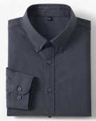 A folded dark gray long-sleeve button-down shirt with a pointed collar and matching buttons, shown on a light gray background with two small inset detail images on the right.