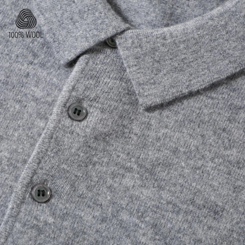 Close-up of a gray heathered wool polo shirt showing the collar, button placket, and a small '100% WOOL' logo in the top-left corner.