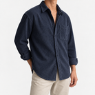 Relaxed corduroy shirt with a curved hem in navy blue, three-quarter model view