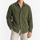 Relaxed corduroy shirt with a curved hem in olive green, front model view