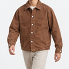 Washed cotton jacket with a gathered hem in rust brown, front model view