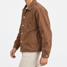 Washed cotton jacket with a gathered hem in rust brown, three-quarter model view