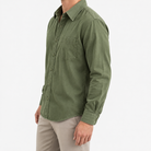 Cotton point collar shirt with a chest pocket in olive green, three-quarter model view