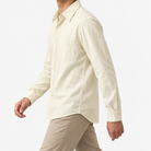 Cotton point collar shirt with a chest pocket in cream, three-quarter model view