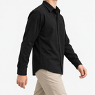 Cotton point collar shirt with a chest pocket in black, three-quarter model view