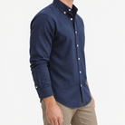 Brushed cotton oxford shirt with a button collar in navy blue, three-quarter model view