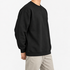 Heavyweight cotton crew neck sweatshirt in black, three-quarter model view