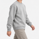 Heavyweight cotton crew neck sweatshirt in light gray, three-quarter model view