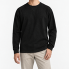 Heavy cotton raglan sleeve crew neck top in black, front model view