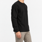 Heavy cotton raglan sleeve crew neck top in black, three-quarter model view