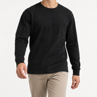 Washed cotton long sleeve jersey top in black, front model view