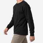 Washed cotton long sleeve jersey top in black, three-quarter model view