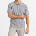 Textured lyocell short sleeve knit polo in light gray, front model view