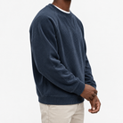 Ribbed raglan sweatshirt with a stitched neckline in navy blue, three-quarter model view