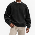 Ribbed raglan sweatshirt with a stitched neckline in black, front model view