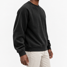 Ribbed raglan sweatshirt with a stitched neckline in black, three-quarter model view