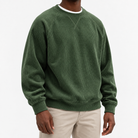 Ribbed raglan sweatshirt with a stitched neckline in forest green, front model view