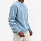 Ribbed raglan sweatshirt with a stitched neckline in light blue, three-quarter model view