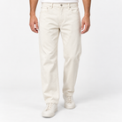 Washed cotton twill five pocket trousers in cream, front model view