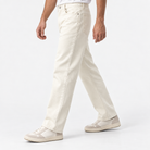 Washed cotton twill five pocket trousers in cream, three-quarter model view