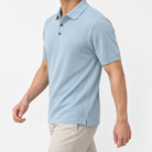 Lyocell silk polo with a fine textured knit in light blue, three-quarter model view