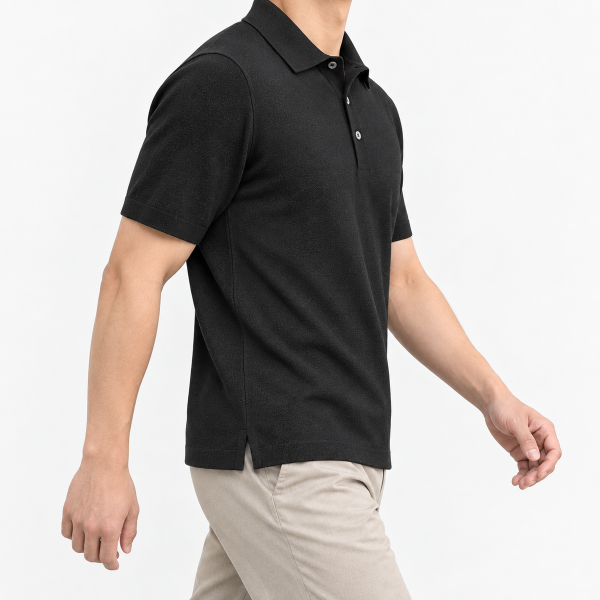Lyocell silk polo with a fine textured knit in black, three-quarter model view