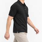 Lyocell silk polo with a fine textured knit in black, three-quarter model view