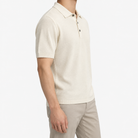 Lyocell silk polo with a fine textured knit in cream, three-quarter model view